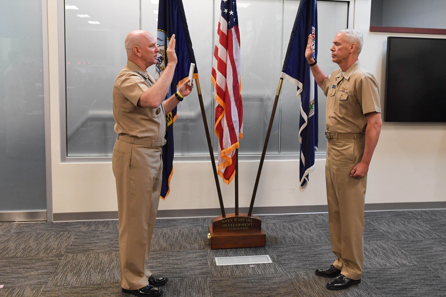 Admiral Christopher W. Grady, left, U.S. Fleet Forces commander, promotes Rear Admiral Fred I. Pyle in a frocking ceremony at Navy Warfare Development Command. The promotion of Pyle, NWDC commander, will be effective August 1, 2020. He is a native of McAlisterville, Pa., and a 1990 graduate of Pennsylvania State University. 
Frocking is the Navy’s practice of allowing promotion selectees to wear the insignia of the higher grade before the official date of promotion.  For an expanded discussion on the origins of this practice, please visit the Naval History and Heritage Command at https://www.history.navy.mil/research/library/online-reading-room/title-list-alphabetically/f/frocking.html.
(U.S. Navy photo by MC1 Jason Pastrik, NWDC/Released)