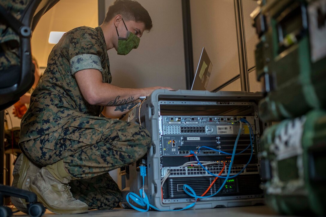 Marine works on a computer network.