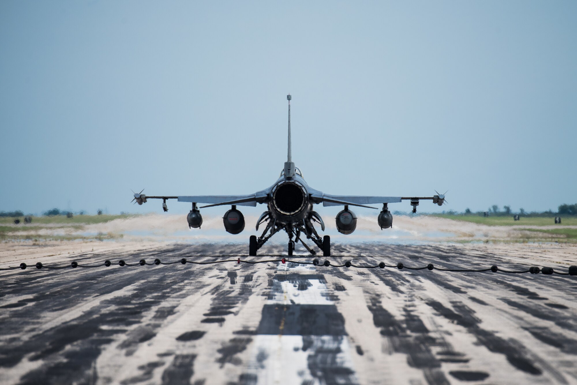 A 77th Fighter Squadron F-16 Fighting Falcon from Shaw Air Force Base, South Carolina, taxis the runway after disengaging a mobile aircraft arresting system Aug. 6, 2020, at McConnell Air Force Base, Kansas. McConnell AFB successfully qualified to provide emergency divert support during Exercise Jaded Thunder 2020. Jaded Thunder is a multi-national joint exercise where units train on tactical aerial combat operations.  (U.S. Air Force photo by Airman 1st Class Marc A. Garcia)