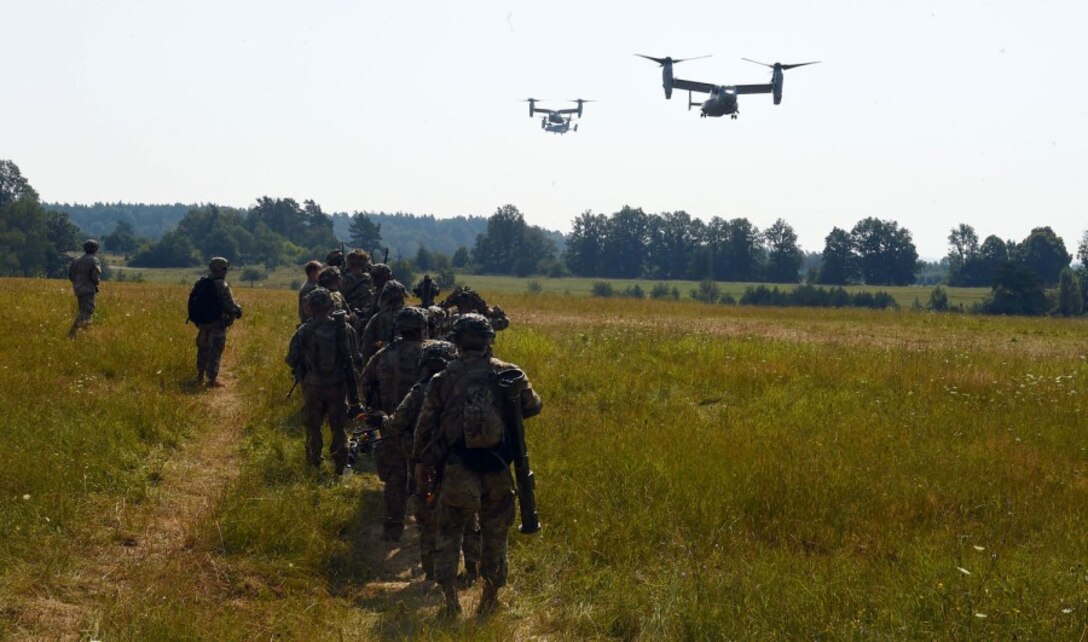 Soldiers with the 173rd Airborne Brigade prepare to be transported on Marine MV-22 Ospreys in Grafenwoehr, Germany, on Aug. 10, 2020, during Exercise Saber Junction. The Marines flew at least three Ospreys around 1,200 miles from Moron in Spain to Grafenwoehr for the exercise.
IMMANUEL JOHNSON/STARS AND STRIPES