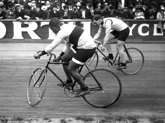 Marshall W. ‘Major’ Taylor (left) and Léon Hourlier race each other at Paris’ Vélodrome Buffalo cycling track in 1909. Taylor, an Indianapolis native, was an African American world champion cyclist who lived and trained in nearby Worcester, Massachusetts at the turn of the last century. (Courtesy Photo, Agence Rol / Public Domain)