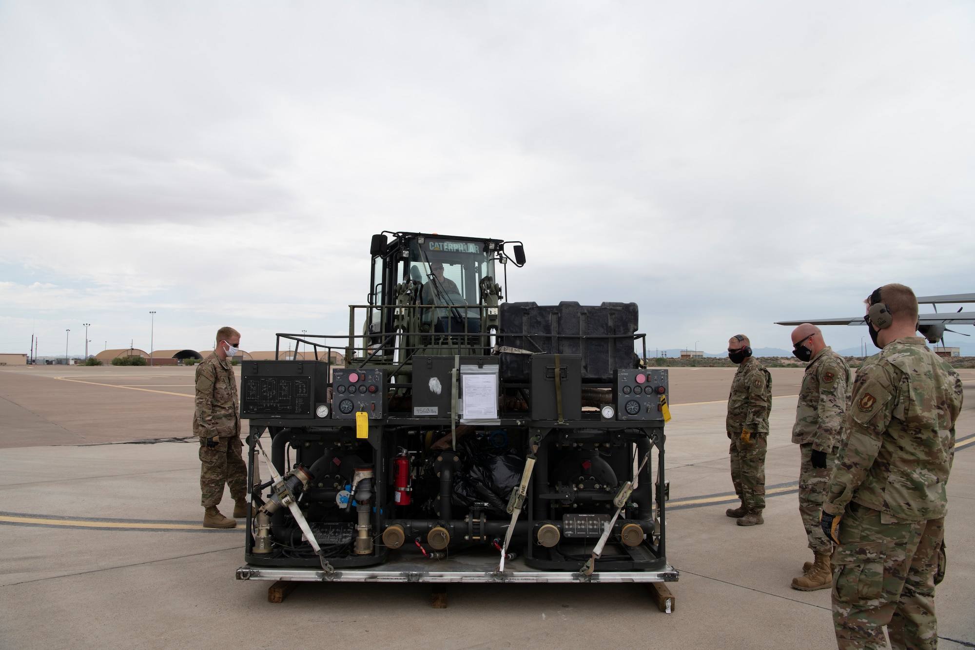 A piece of equipment is prepared to be loaded onto a plane