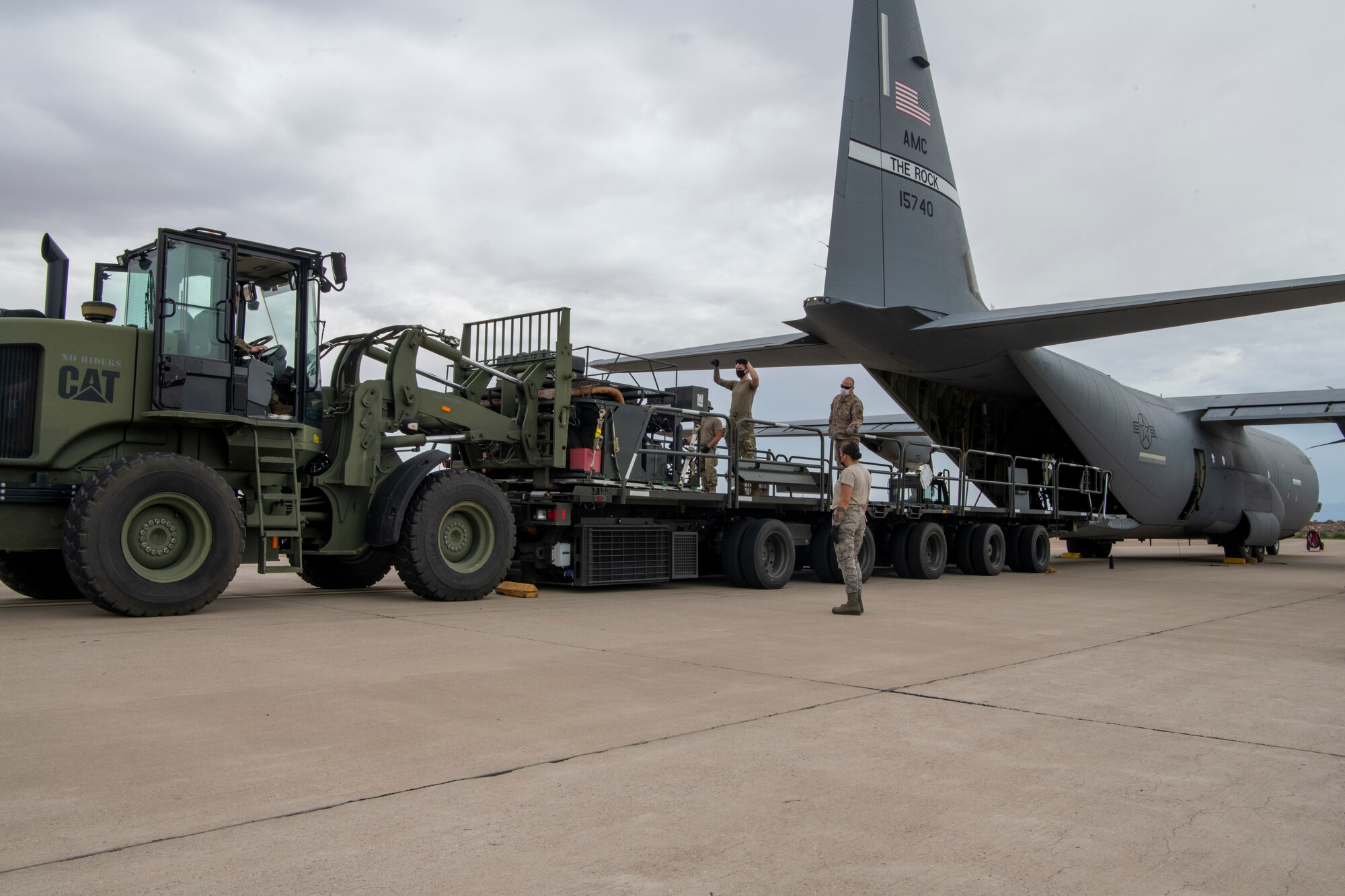 A fuel pump is loaded onto a C-130J Super Hercules