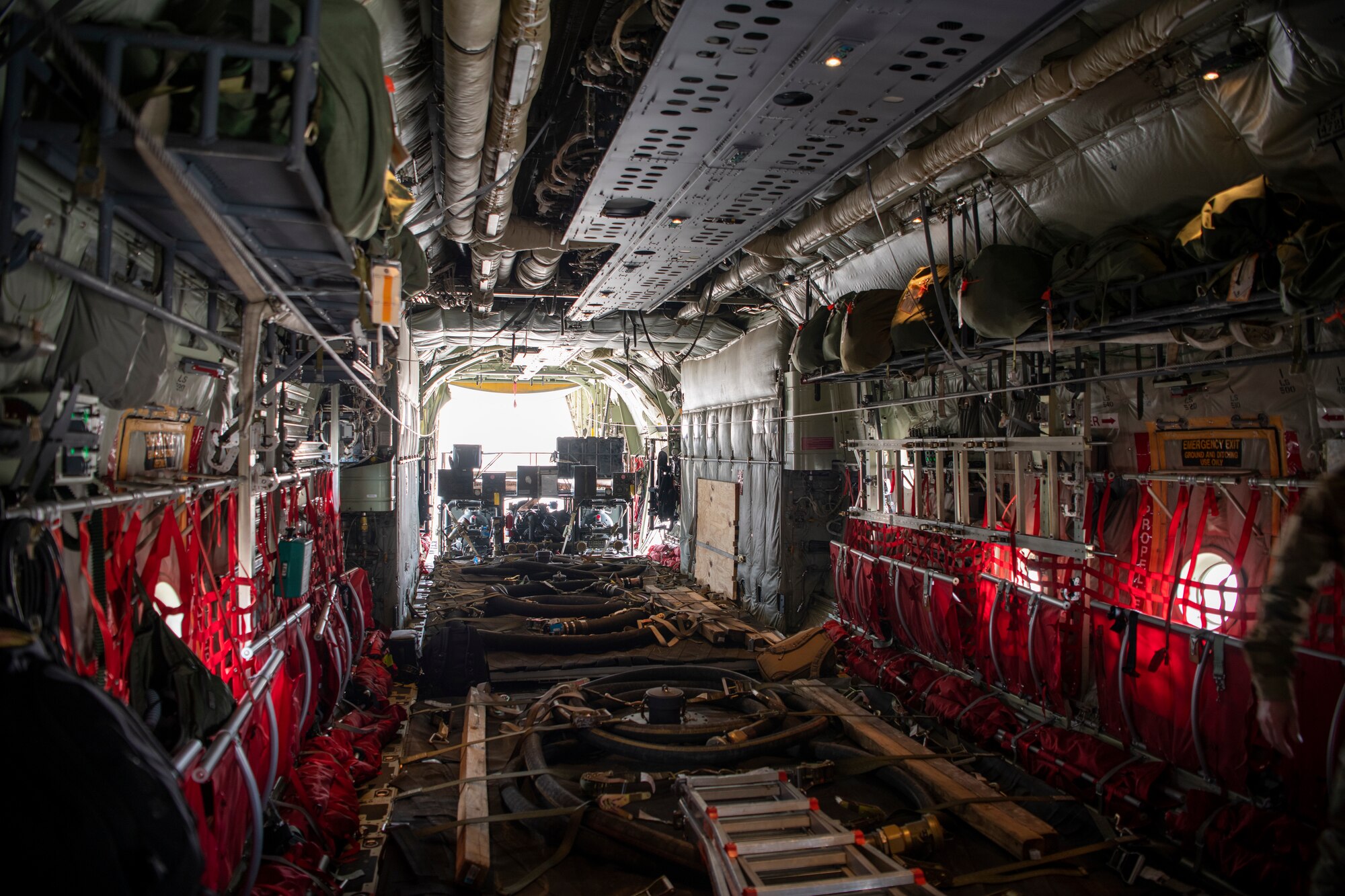 A fuel pump bladder is loaded onto a C-130J Super Hercules