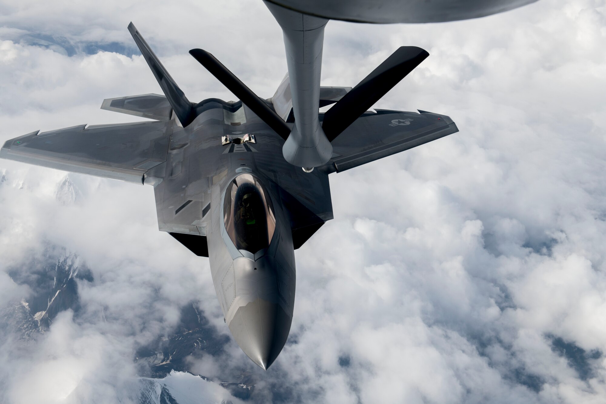 A U.S. Air Force F-22 Raptor from the 354th Fighter Wing prepares to be air refueled by a KC-135 Stratotanker from the 92nd Air Refueling Wing during field training exercise Red Flag Alaska 20-3, Aug. 4, 2020. RFA 20-3 is a Pacific Air Force directed field training exercise for U.S. and international forces flown under simulated air combat conditions. (U.S. Air Force Photo by Senior Airman Lawrence Sena)