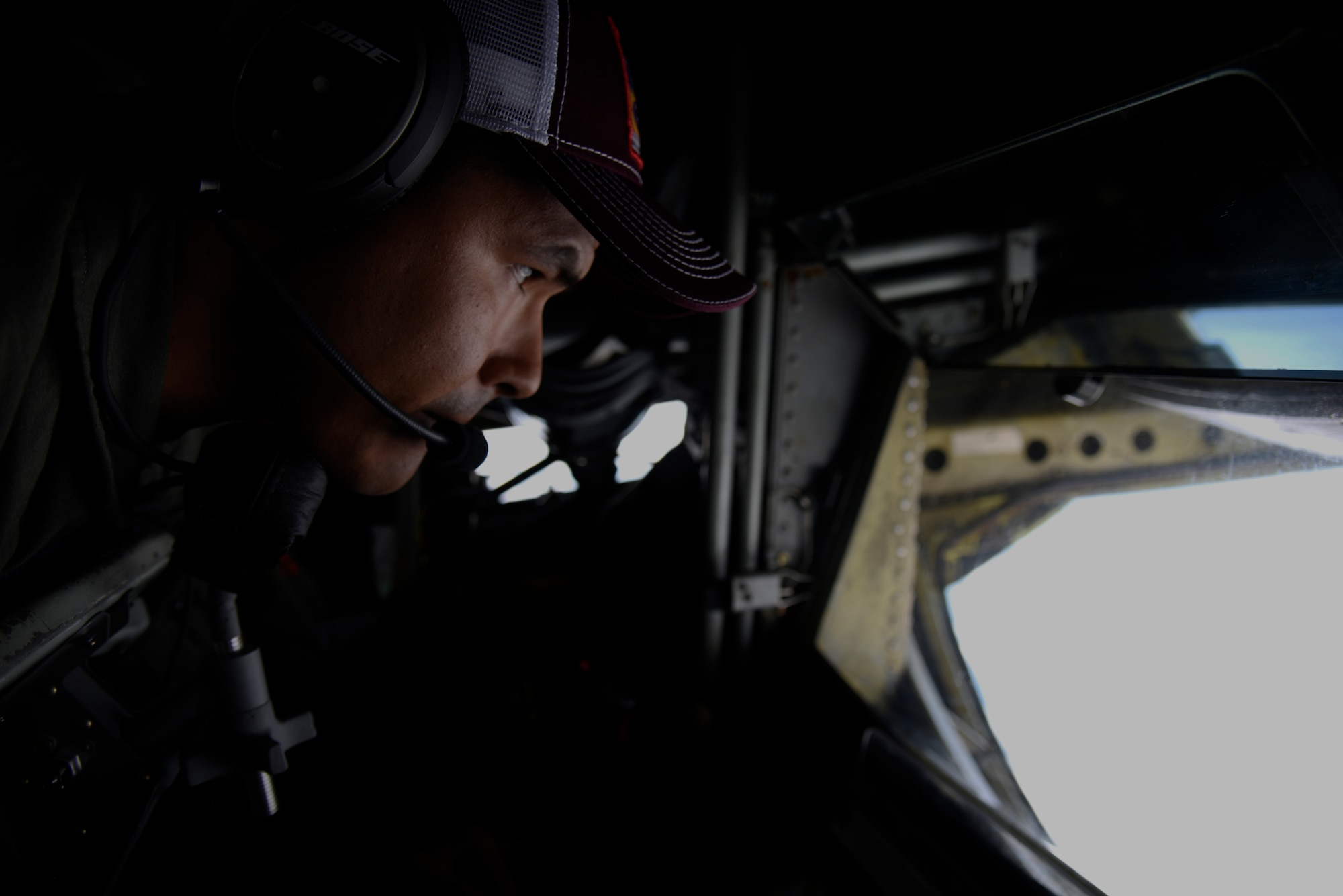 U.S. Air Force Tech. Sgt. Jose Cruz, 384th Air Refueling Squadron boom operator, conducts air refueling during field training exercise Red Flag Alaska 20-3, Aug. 5, 2020. This exercise reinforces the United States’ continued commitment to the region as a Pacific nation, leader and power. (U.S. Air Force photo by Staff Sgt. Jesenia Landaverde)