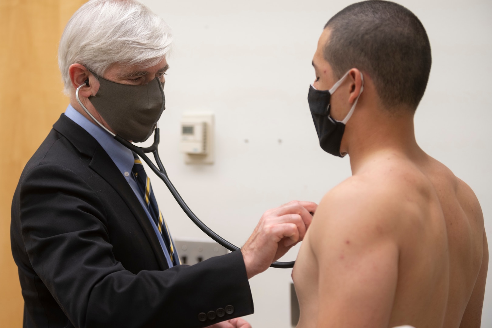 Dr. Mark Haigney, Professor of Medicine at the Uniformed Services University, performs an electrocardiogram on midshipmen 4th Class, or plebes, from the United States Naval Academy Class of 2024.