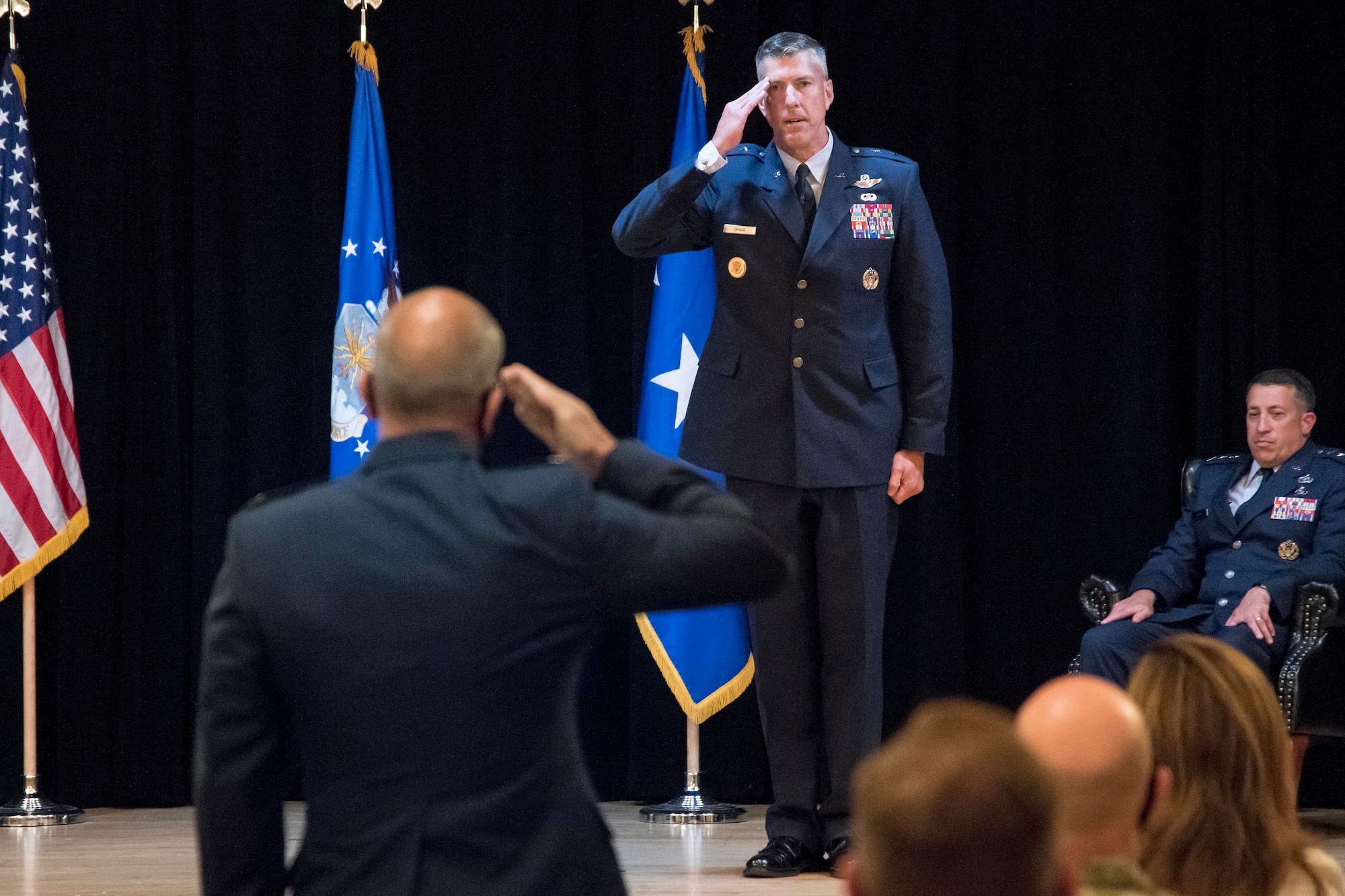 photo of major general craige saluting a member in the audience