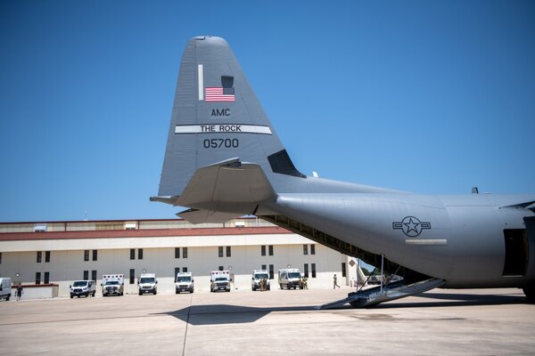 Ambulances transporting eight spinal cord injury patients from Audie Murphy Veterans Affairs Medical Center, South Texas Veterans Health Care System, San Antonio, Texas, arrive at Joint Base San Antonio-Kelly Airfield, Texas, on Tuesday, July 14, 2020