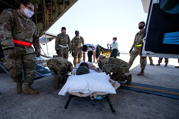 One of eight spinal cord injury patients from Audie Murphy Veterans Affairs Medical Center, South Texas Veterans Health Care System, San Antonio, Texas, is moved onto a U.S. Air Force C-130 aircraft at Joint Base San Antonio-Kelly Airfield, Texas, Tuesday, July 14, 2020, for a brief flight to Dallas Love Field Airport, Texas.