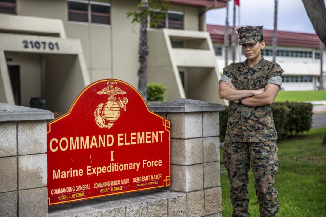 U.S. Marine Sgt. Roxanne Gorostieta, the administrative chief with the Command Element, I Marine Expeditionary Force, poses in front of the command’s sign in 21 Area on Marine Corps Base Camp Pendleton, California, July 28, 2020. Gorostieta uses her knowledge and experience in fitness and the Marine Corps Martial Arts Program to train and educate her Marines. Gorostieta is a native of Phoenix. (U.S. Marine Corps photo by Lance Cpl. Alison Dostie)