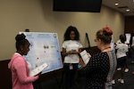 Naval Surface Warfare Center, Philadelphia Division (NSWCPD) employees serve as judges during the 2018 Girl Scouts of Eastern Pennsylvania (GESP) Science, Technology, and Mathematics (STEM) Experience Summer Camp poster session. This year the camp was run virtually through video calls with virtual presentations replacing the poster session. : (U.S. Navy photo by Keegan Rammel/Released)
