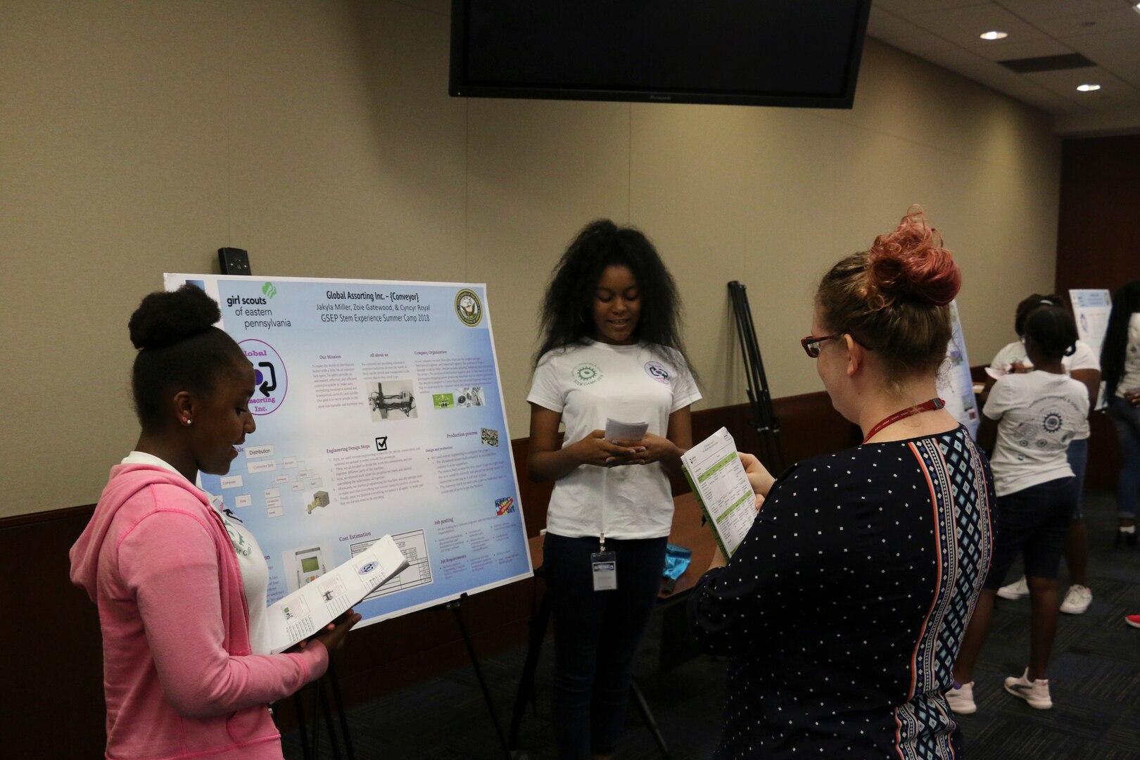 Naval Surface Warfare Center, Philadelphia Division (NSWCPD) employees serve as judges during the 2018 Girl Scouts of Eastern Pennsylvania (GESP) Science, Technology, and Mathematics (STEM) Experience Summer Camp poster session. This year the camp was run virtually through video calls with virtual presentations replacing the poster session. : (U.S. Navy photo by Keegan Rammel/Released)