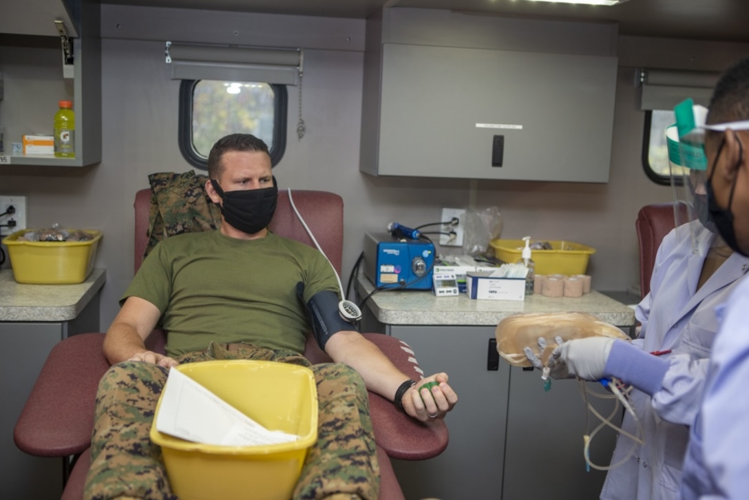 U.S. Marine Capt. Kyle Kuhn, the assistant officer in charge of the Center for Naval Aviation Technical Training Marine Detachment, waits to donate blood and be tested for coronavirus antibodies outside of the CNATT schoolhouse on Marine Corps Base Camp Pendleton, California, Aug. 10, 2020. The event was hosted by the Armed Services Blood Program. Each donor went through a screening process, then donated one pint of blood, which could save up to three lives. As part of the screening process, each donation was tested for COVID-19 antibodies, which could determine if the donor had previously been exposed to the virus. (U.S. Marine Corps photo by Lance Cpl. Drake Nickels)