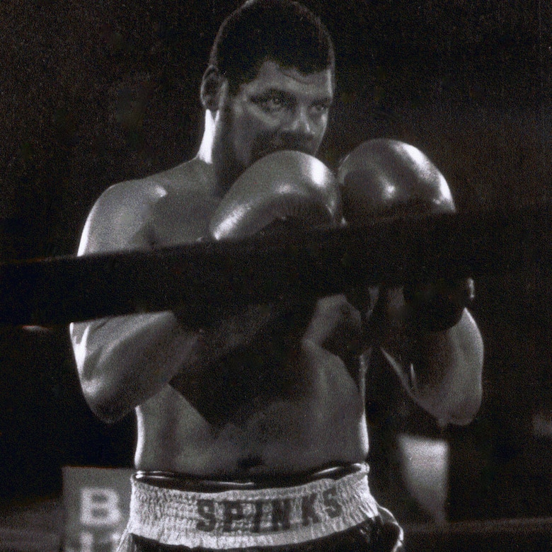 Boxer takes boxing stance.