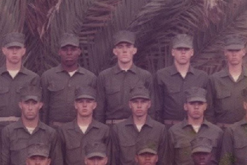 Marines pose for a graduation photo.