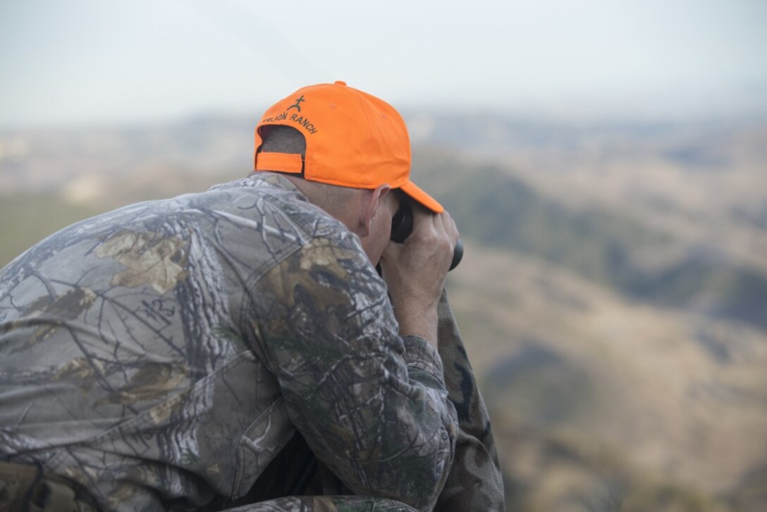 U.S. Marine Corps Col. Jeffrey Holt, deputy commander of Marine Corps Installations West, Marine Corps Base (MCB) Camp Pendleton, searches for deer during a hunting session in the 52 area of MCB Camp Pendleton, California, Nov. 4, 2018. Deer hunting season runs from the 3rd through the 25th of November, and just as is the case for other wildlife hunting seasons, it is conducted to preserve a sustainable wildlife environment throughout MCB Camp Pendleton. (U.S. Marine Corps Photo by Cpl. Dylan Chagnon)
