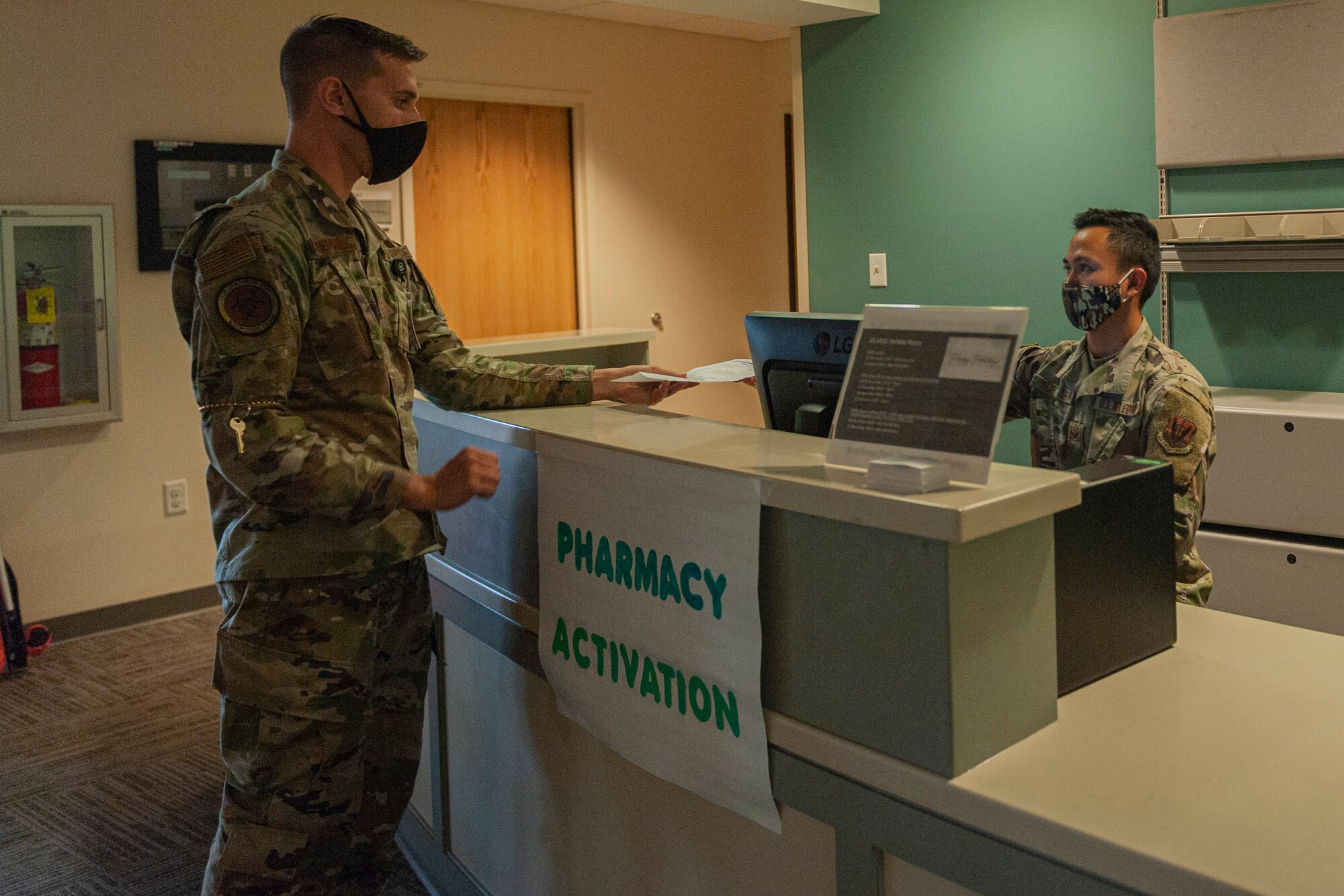 Photo of an Airman receiving a paper prescription