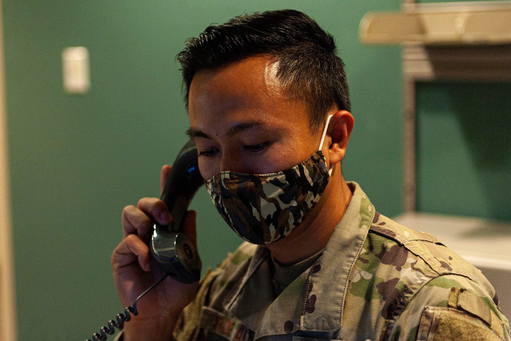 Photo of an Airman speaking to a customer
