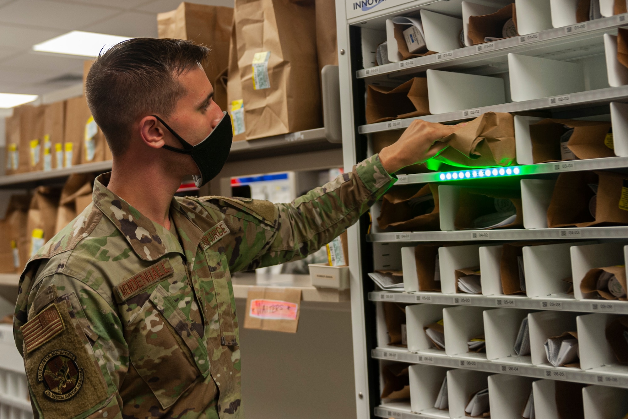 Photo of an Airman grabbing a prescription
