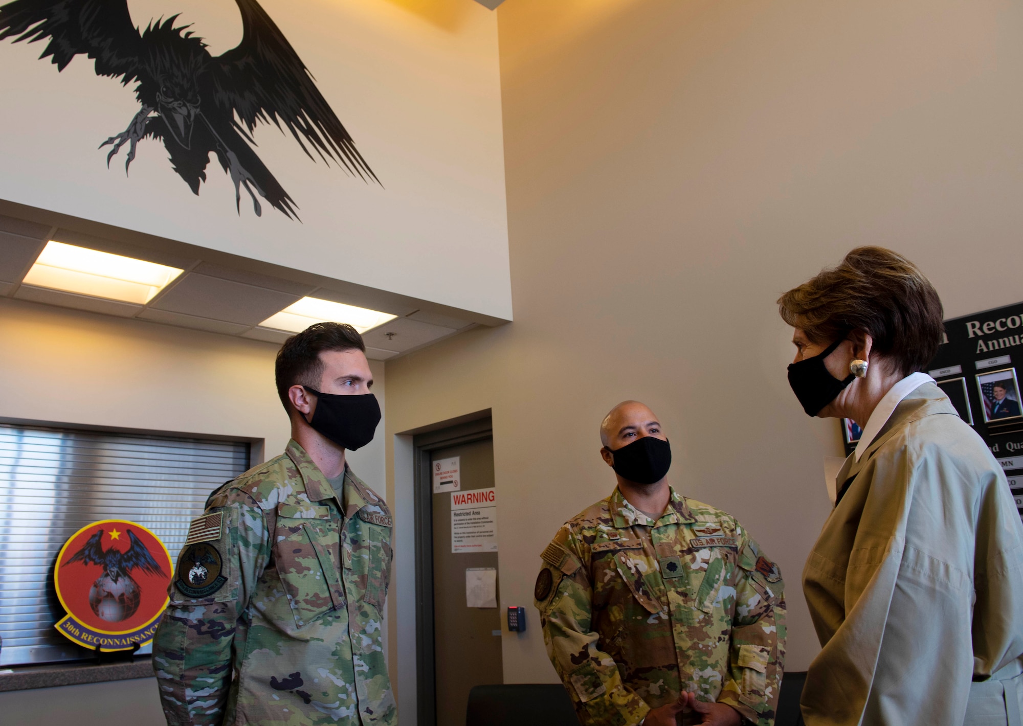 Secretary of the Air Force Barbara Barrett speaks with Hunter Airmen in the building of the 30th Reconnaissance Squadron.