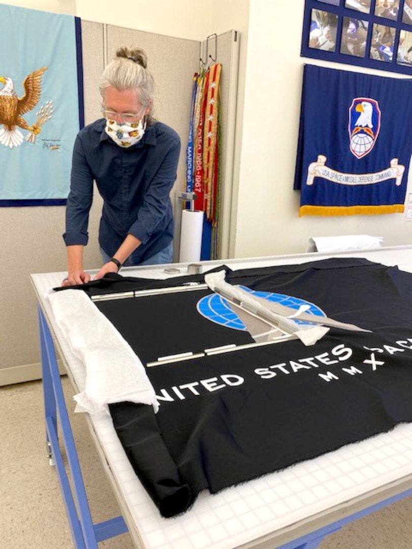 DLA Troop Support embroidery digitizer Adam Walstrum works on a Space Force flag in the Clothing and Textiles flag room in Philadelphia, July 29, 2020. Walstrum is one of three flag room employees who’ve proven essential to the flag room’s mission since the COVID-19 pandemic began in March.