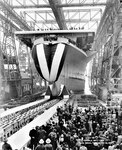 Norfolk Naval Shipyard’s first of three aircraft carriers constructed during World War II, USS Shangri-La (CV-38), shown here at its Feb. 24, 1944 commissioning, reported to the Fast Carrier Task Force in April 1945, launching air strikes on targets in Tokyo, providing close air support over Okinawa, airdropping supplies to Allied prisoners in Japan and later assuming occupation duties.