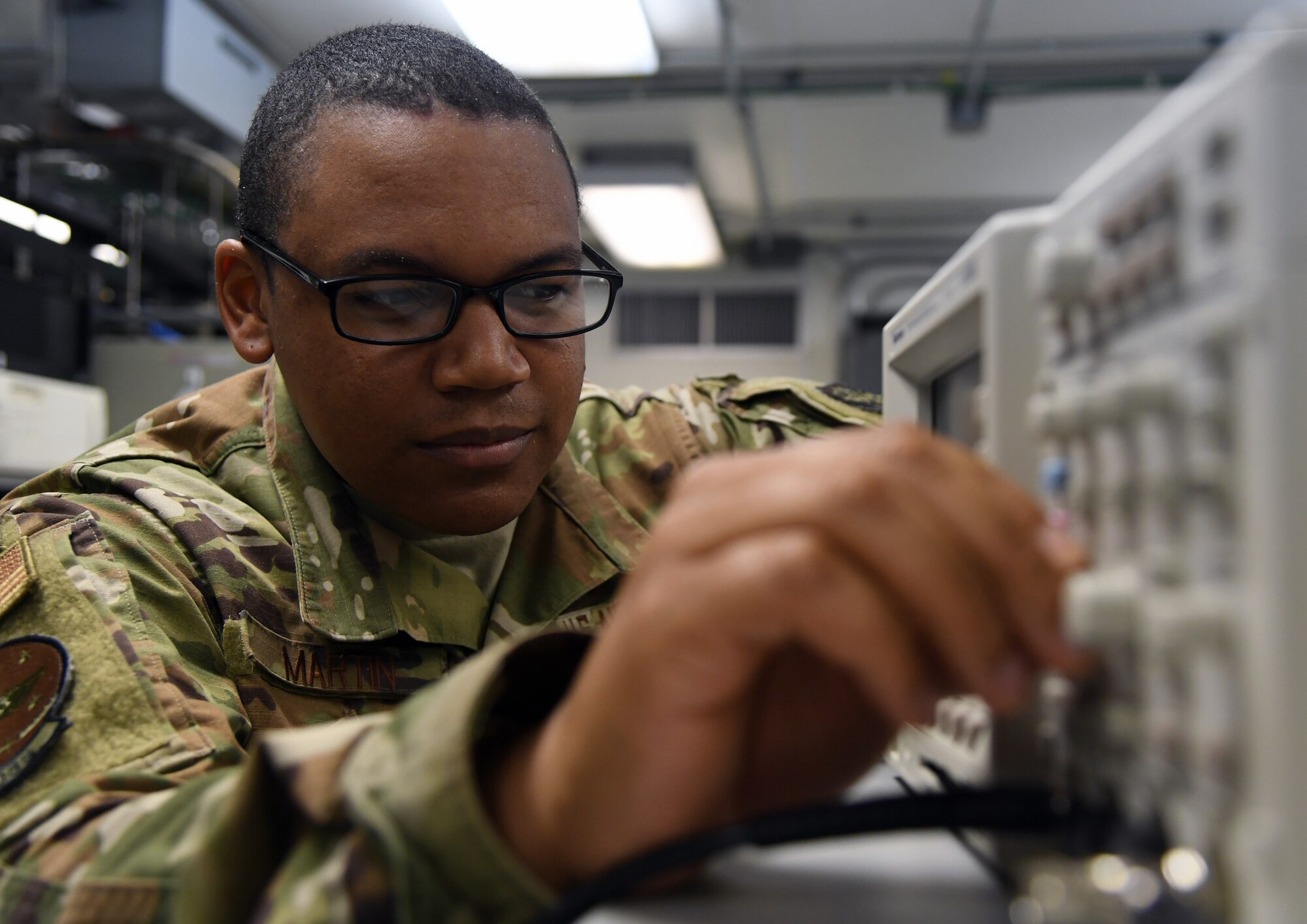 airmen working on equipment