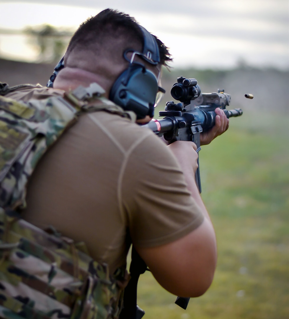 Senior Airman Sam Garza, 149th Security Forces Squadron, Air National Guard, shoots his weapon at a firing range at Joint Base San Antonio-Chapman Annex Aug. 12.