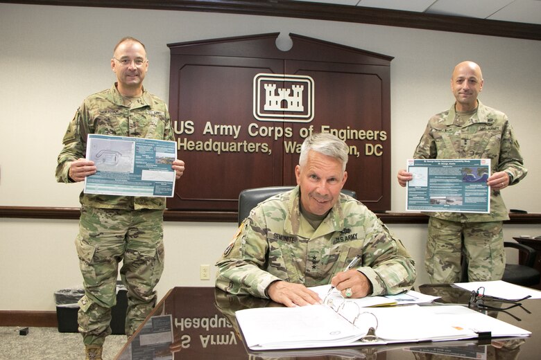 Lt. Gen. Todd Semonite, USACE Commanding General and 54th Chief of Engineers, poses while signing the St. George Harbor Improvement Chief’s Report August 13, 2020, in the Washington D.C. Headquarters of the U.S. Army Chief of Engineers as Maj. Gen. William "Butch" Graham (left) and Maj. Gen. (Promotable) Scott Spellmon (right) observe.