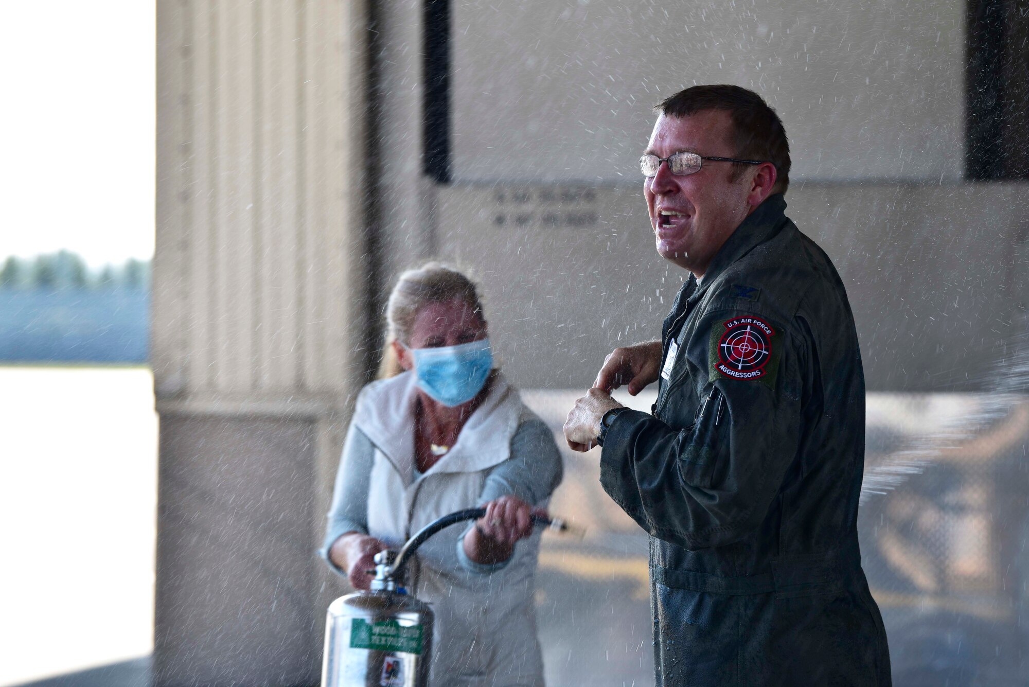 U.S. Air Force Col. Shawn E. Anger, the 354th Fighter Wing commander, is welcomed by friends after his fini flight on Eielson Air Force Base, Alaska, Aug. 13, 2020. Anger served 24 years as an Air Force pilot, flying five different aircraft spanning his 11 assignments. (U.S. Air Force photo by Senior Airman Beaux Hebert)