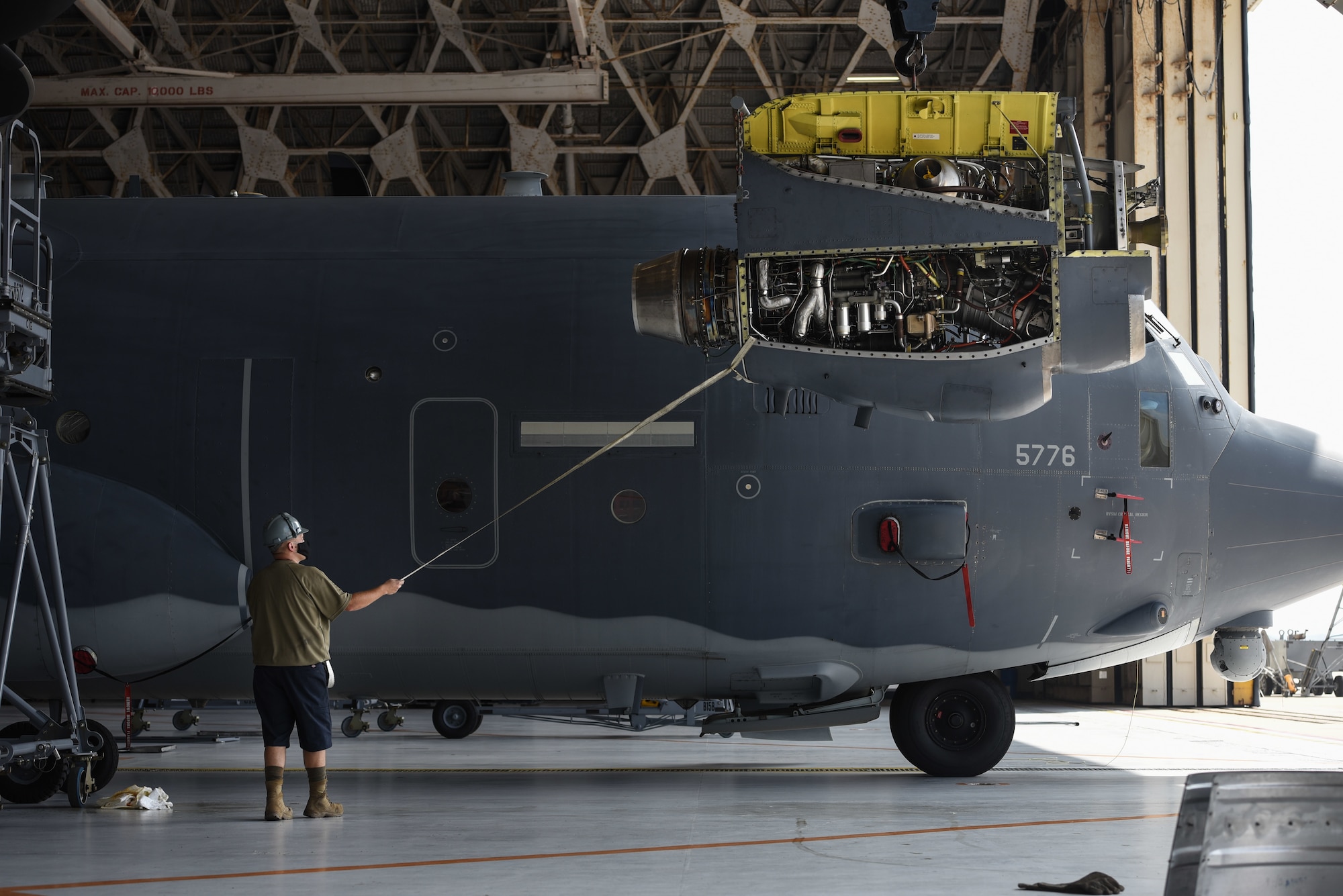 Airmen from the 353rd Special Operations Aircraft Maintenance Squadron perform engine maintenance on an MC-130J Commando II Aug. 6, 2020, at Kadena Air Base, Japan.