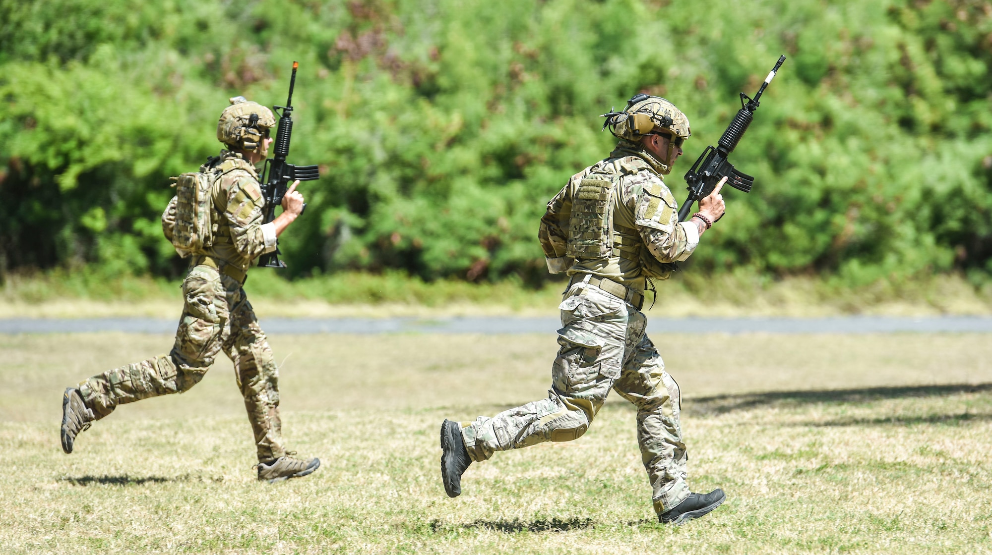 Airmen from the 25th Air Support Operations Squadron conduct field training exercises at Bellows Air Force Station, Hawaii, July 29, 2020. Airmen were evaluated on communication skills and tactical movements in a simulated combat environment. (U.S. Air Force photo by Tech. Sgt. Anthony Nelson Jr.)