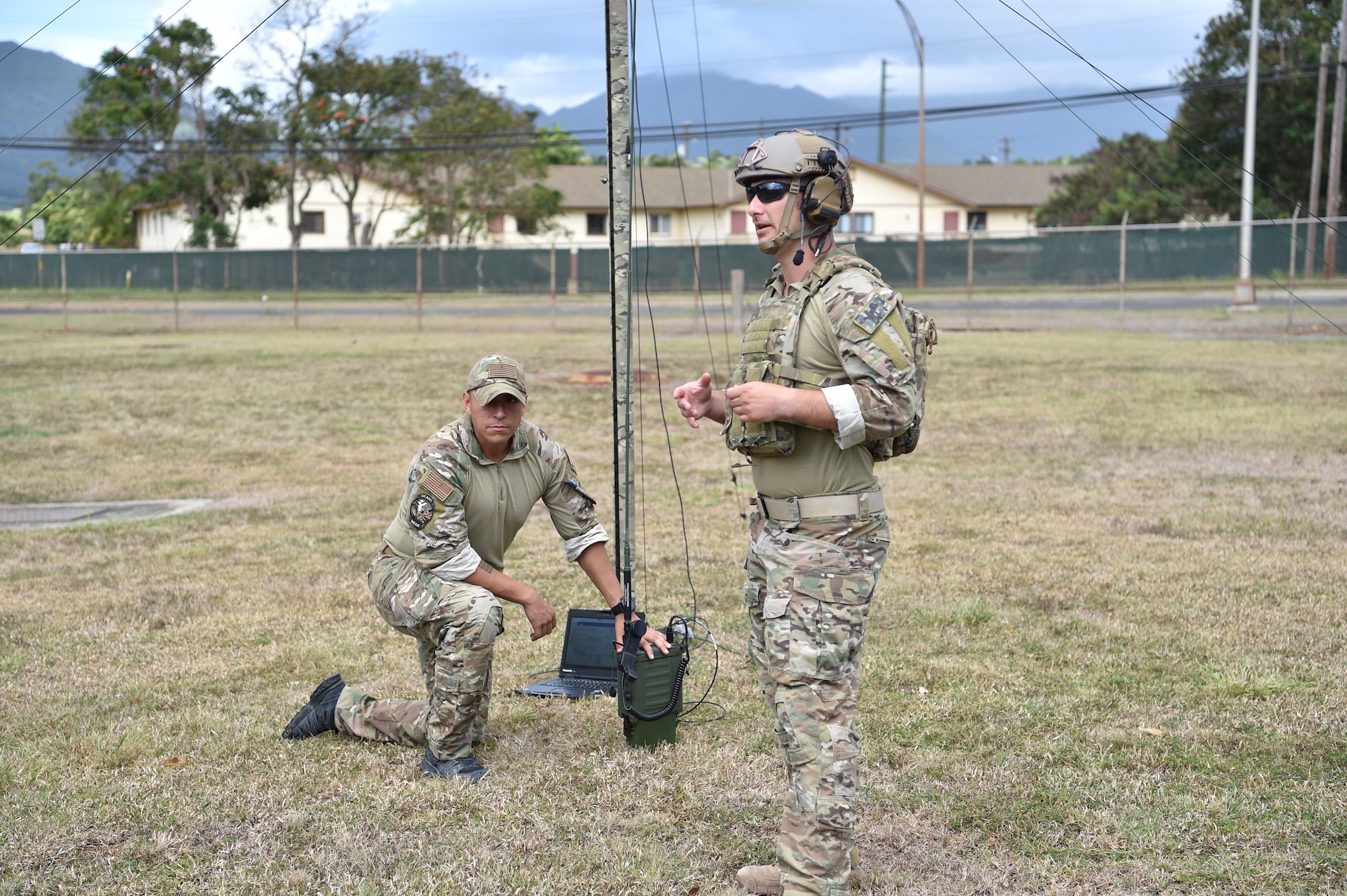 Airman First Class Eric Bravo and Tech. Sgt. Joshua McKeever, both 25th Air Support Operations Squadron tactical air control party Airmen, instruct how the infield radio antenna enables communication in the field at Joint Base Pearl Harbor-Hickam, Hawaii, August 5, 2020. The lesson helped Airmen understand the communications network they will deal with in a deployed location. (U.S. Air Force photo by 2nd Lt. Benjamin Aronson)