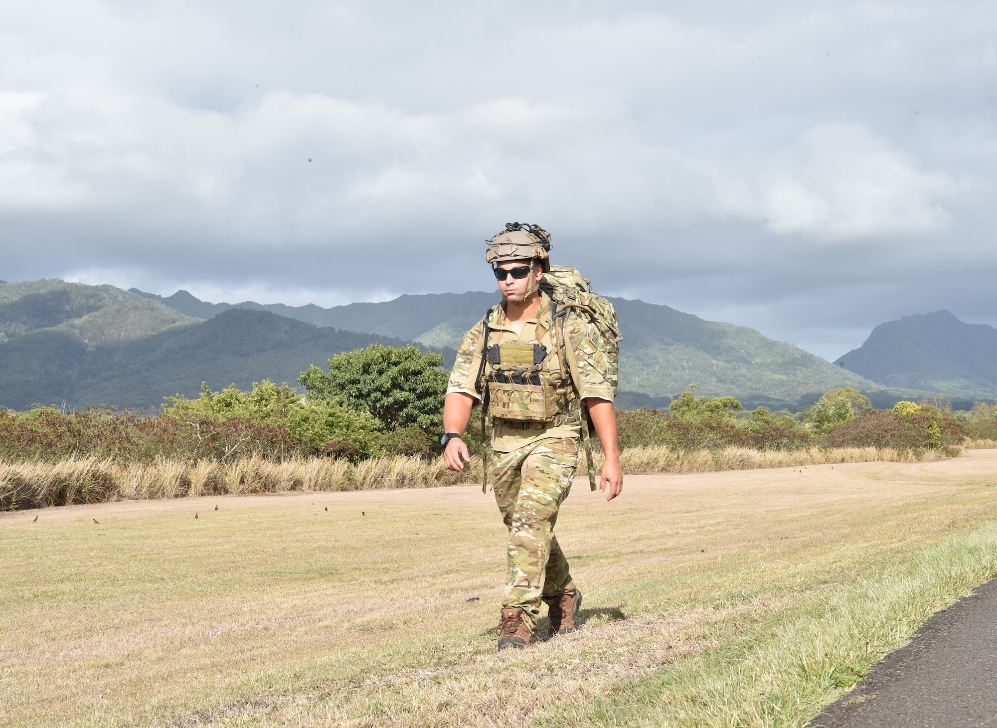 Staff Sgt. Robert Gallagher, 25th Air Support Operations Squadron tactical air control party Airman, participates in a three-mile ruck in full gear during an exercise to learn about field network capabilities at Joint Base Pearl Harbor-Hickam, Hawaii, August 5, 2020. The ruck simulated a deployed experience while providing a workout. (U.S. Air Force photo by 2nd Lt. Benjamin Aronson)