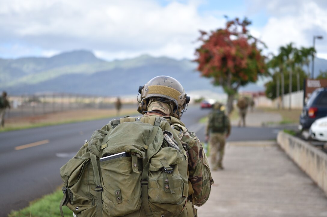 Airmen from the 25th Air Support Operations Squadron perform a three-mile ruck in full gear while stopping at different stations to learn about EvolutionONE, a GPS communication system, at Joint Base Pearl Harbor-Hickam, Hawaii, August 5, 2020. This training served as a mid-year assessment of the unit’s innovation tactics. (U.S. Air Force photo by 2nd Lt. Benjamin Aronson)
