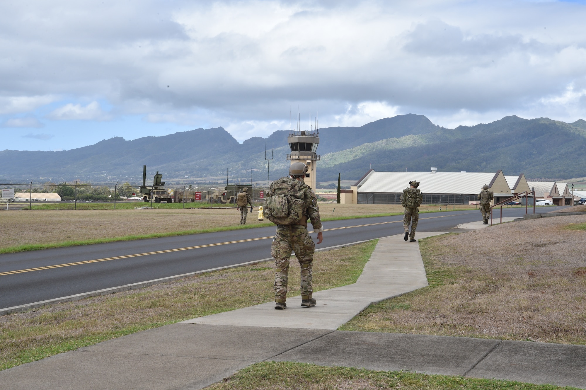 Airmen from the 25th Air Support Operations Squadron perform a three-mile ruck in full gear while stopping at different stations to learn about EvolutionONE, a GPS communication system, at Joint Base Pearl Harbor-Hickam, Hawaii, August 5, 2020. This training served as a mid-year assessment of the unit’s innovation tactics. (U.S. Air Force photo by 2nd Lt. Benjamin Aronson)