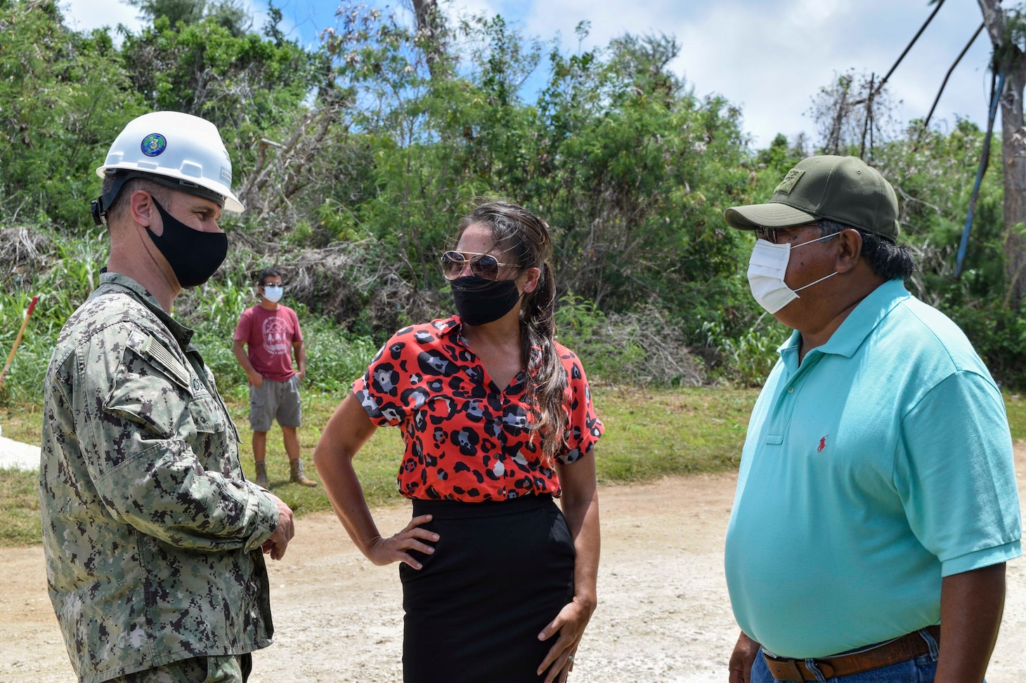 200810-N-HK244-1112 TINIAN, Commonwealth of the Northern Mariana Islands (Aug. 10, 2020) Capt. Eric Correll, commodore of Commander Task Force 75, speaks with Tinian residents following a ground-breaking ceremony in Marpo Heights for a Department of Defense Innovative Readiness Training road repair improvement project. NMCB-3 is deployed across the Indo-Pacific region conducting high-quality construction to support U.S. and partner nations to strengthen partnerships, deter aggression, and enable expeditionary logistics and naval power projection. The battalion stands ready to complete assigned tasking, support Humanitarian Aid/Disaster Relief and Major Combat Operations throughout the area of responsibility. (U.S. Navy photo by Construction Electrician 3rd Class Constructionman Marcus Henley/Released)