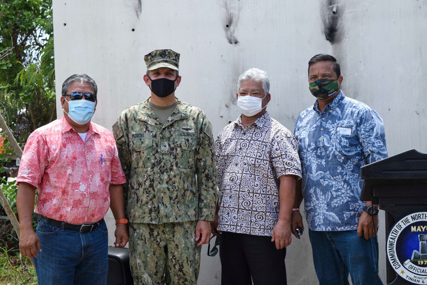 200810-N-HK244-1118 TINIAN, Commonwealth of the Northern Mariana Islands (Aug. 10, 2020) Tinian Mayor Edwin Aldan, Rear Adm. John Menoni, commander of Joint Region Marianas, Lieutenant Governor Arnold Palacios, and Senator Jude Hofschneider, chairman of the 21st Tinian Legislative Delegation, pose for a photo following a ground-breaking ceremony in Marpo Heights for a Department of Defense Innovative Readiness Training road repair improvement project. NMCB-3 is deployed across the Indo-Pacific region conducting high-quality construction to support U.S. and partner nations to strengthen partnerships, deter aggression, and enable expeditionary logistics and naval power projection. The battalion stands ready to complete assigned tasking, support Humanitarian Aid/Disaster Relief and Major Combat Operations throughout the area of responsibility. (U.S. Navy photo by Construction Electrician 3rd Class Constructionman Marcus Henley/Released)