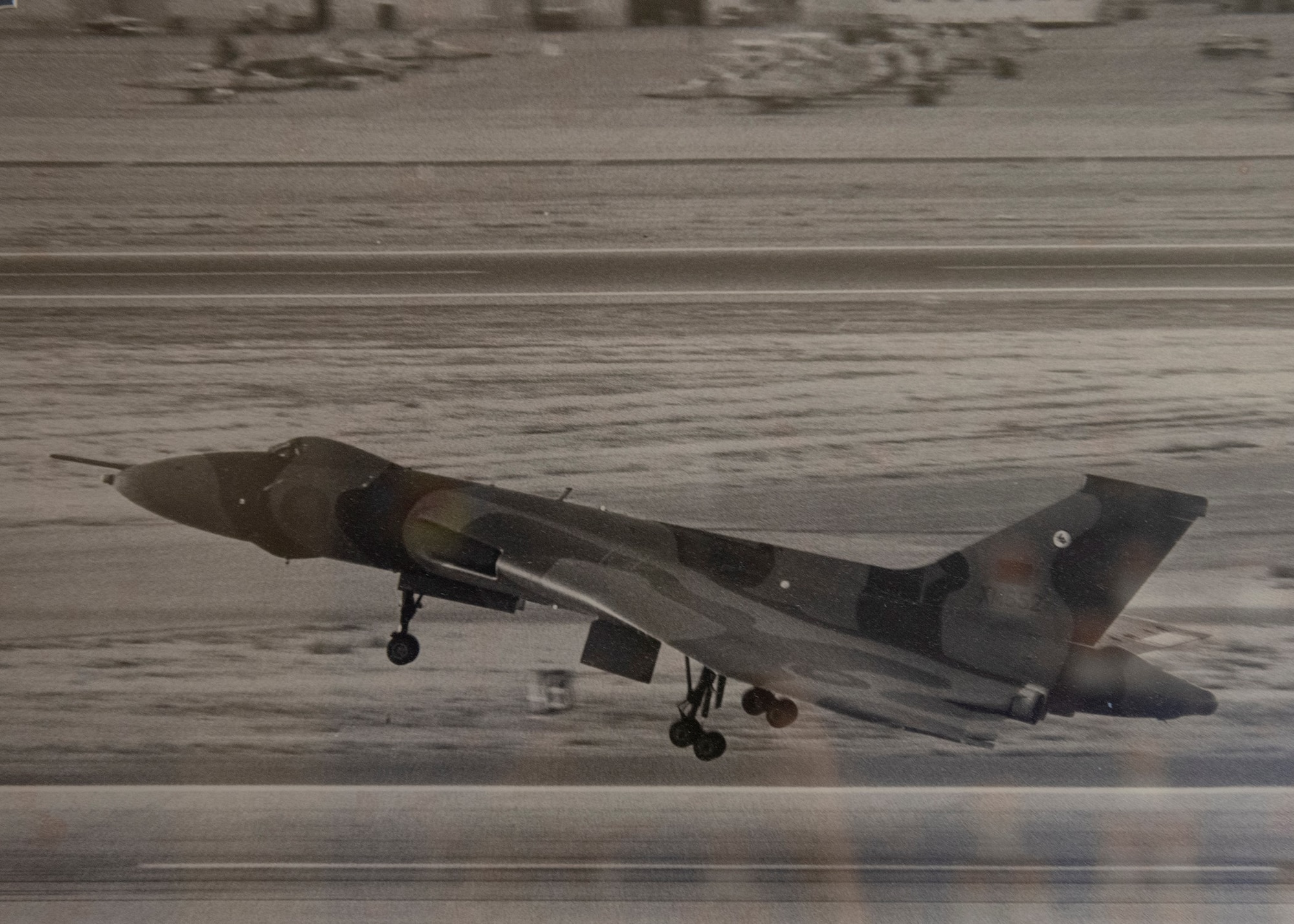 An aircraft lands at Nellis Air Force Base.