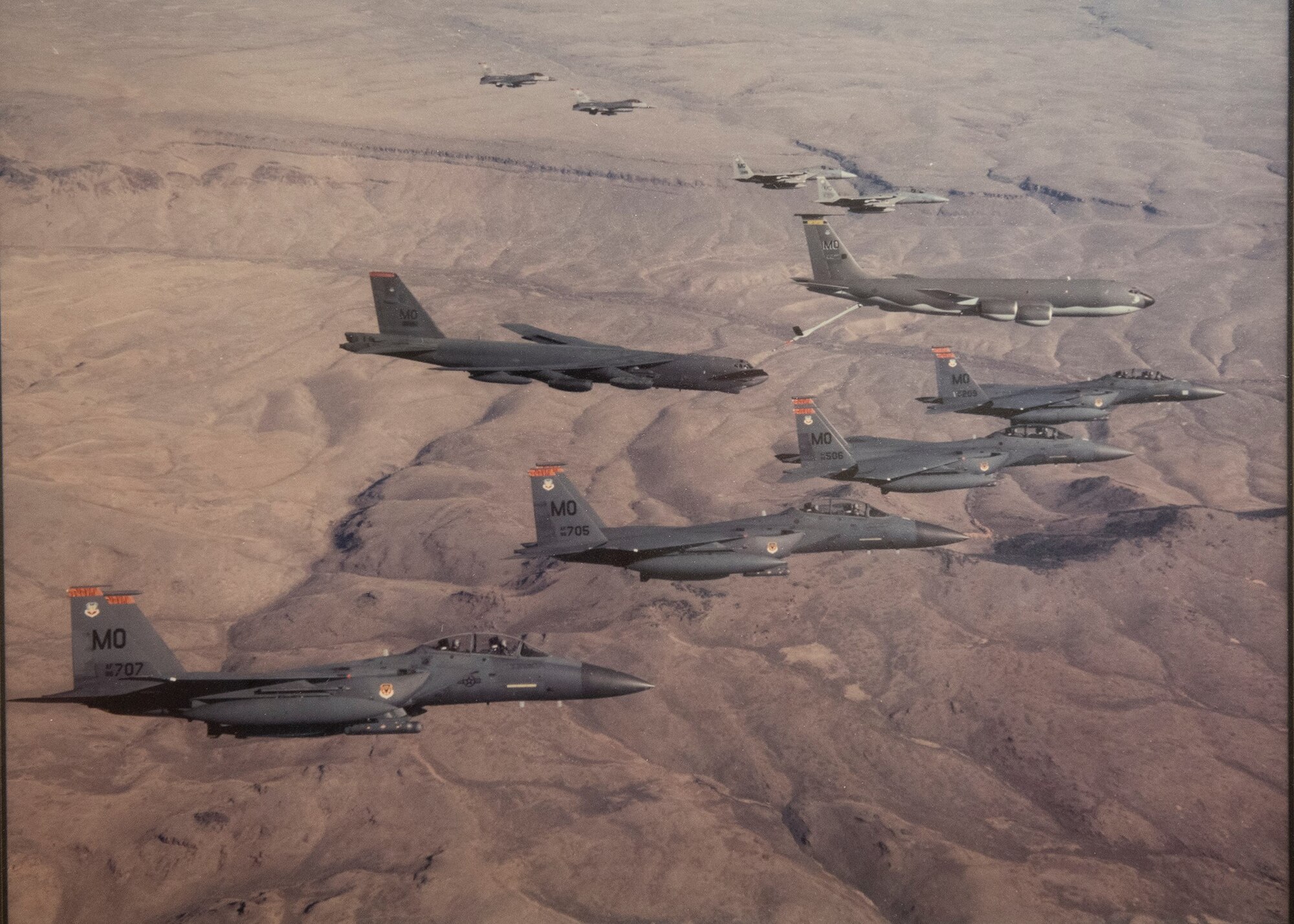 Various aircraft fly in formation over the Nevada Test and Training Range.