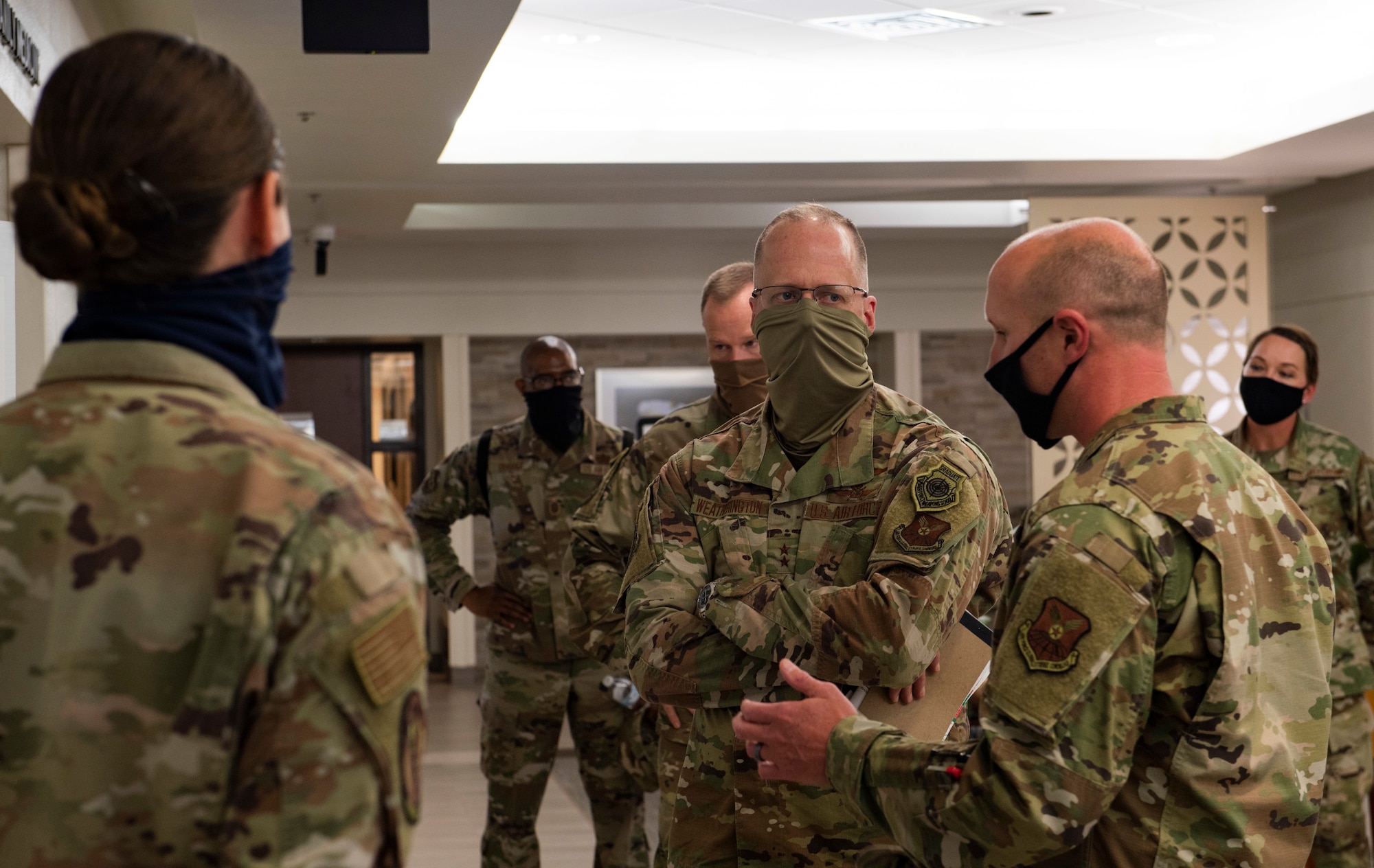 Master Sgt. Eric Roberts, 7th Medical Support Squadron superintendent, right, briefs Maj. Gen. Mark Weatherington, 8th Air Force and Joint-Global Strike Operations Center commander, middle, at Dyess Air Force Base, Texas, Aug. 11, 2020.