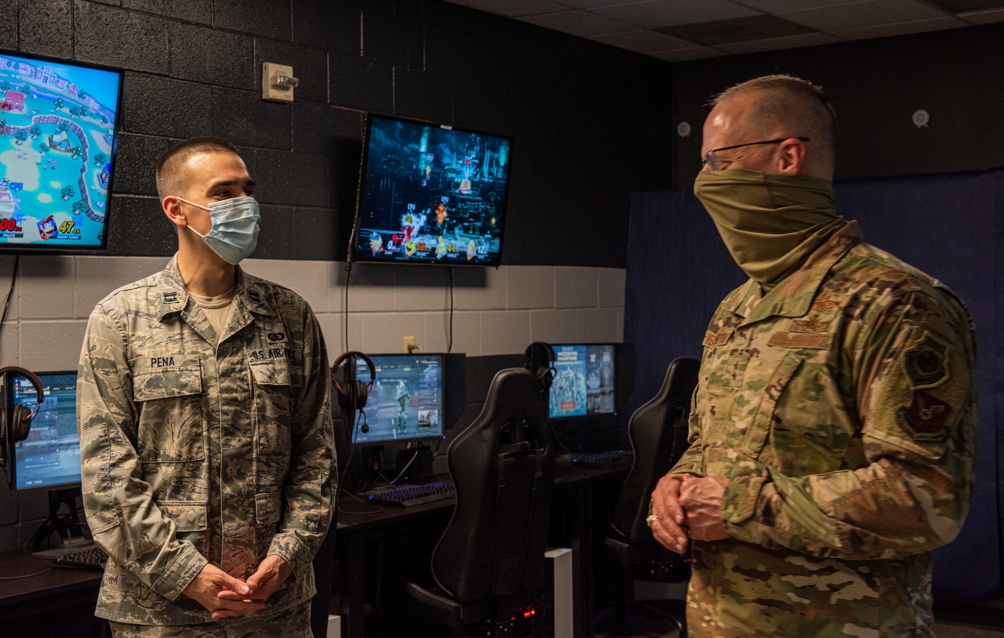 Maj. Gen. Mark Weatherington, 8th Air Force and Joint-Global Strike Operations Center commander, right, questions Capt. Simmon Pena, 7th Force Support Squadron military personnel flight commander, about the eSports program at Dyess Air Force Base, Texas, Aug. 11, 2020.