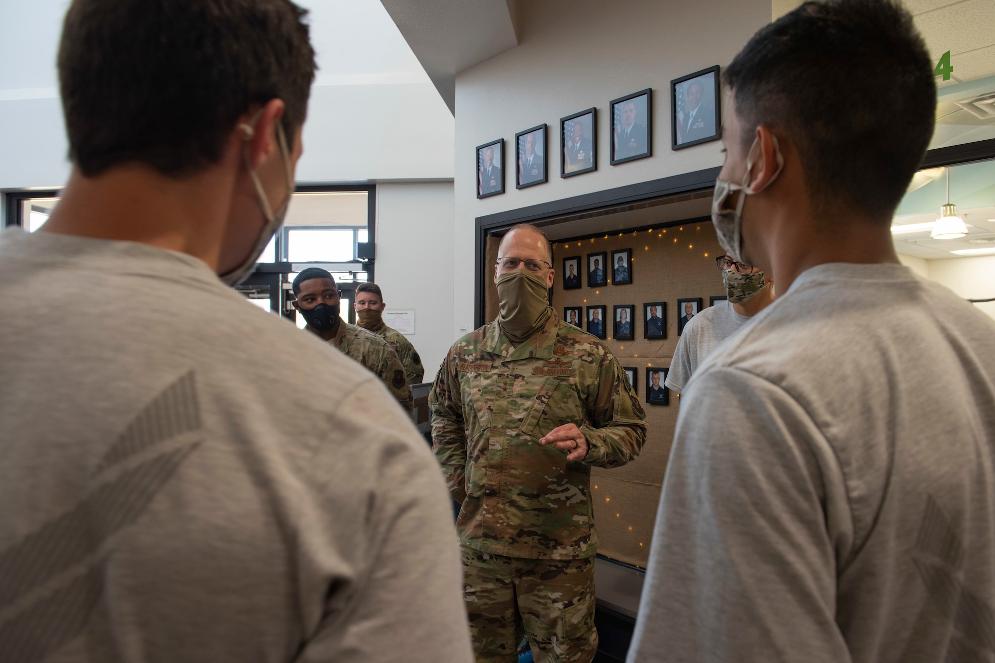 Maj. Gen. Mark Weatherington, 8th Air Force and Joint-Global Strike Operations Center commander, middle, talks with Airmen assigned to the 7th Force Support Squadron about their careers and well-being at Dyess Air Force Base, Texas, Aug. 11, 2020.