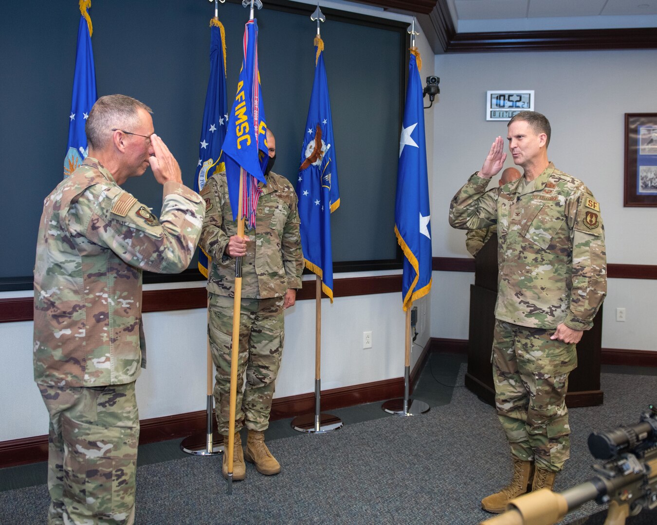 Col. Aaron Guill, right, Air Force Security Forces Center gaining commander, salutes Maj. Gen. Tom Wilcox, Air Force Installation and Mission Support Center commander, during the AFSFC change of command ceremony held at Joint Base San Antonio-Lackland, Texas, Aug. 11, 2020. Guill gained command from Col. Brian S. Greenroad. (U.S. Air Force photo by Sarayuth Pinthong)