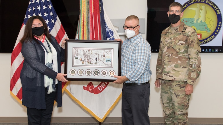 Brig. Gen. Peter D. Helmlinger and Tony Kirk present Patti Williams an award with commanders’ coins from the Kansas City, Portland, Omaha, Seattle and Walla Walla districts and Northwestern Division.