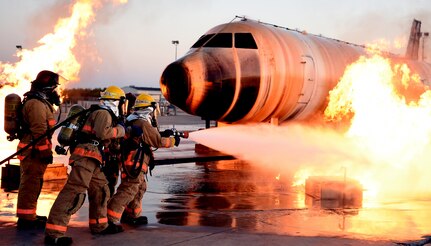 airmen fighting an aircraft fire