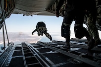 A member of Explosive Ordnance Disposal Mobile Unit (EODMU) 11, free-fall jumps out of a C-130 Hercules aircraft assigned to the Wyoming Air National Guard 153rd Airlift Wing as part of maritime insertion training run by Explosive Ordnance Disposal Training and Evaluation Unit (EODTEU) 1 off the coast of San Diego, July 30, 2020.