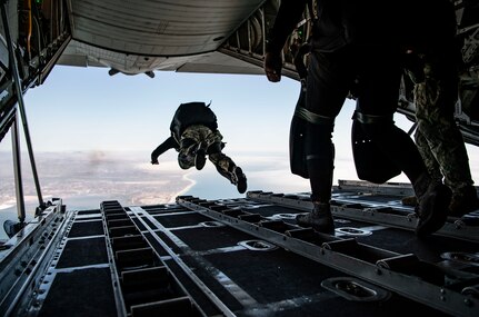 A member of Explosive Ordnance Disposal Mobile Unit (EODMU) 11, free-fall jumps out of a C-130 Hercules aircraft assigned to the Wyoming Air National Guard 153rd Airlift Wing as part of maritime insertion training run by Explosive Ordnance Disposal Training and Evaluation Unit (EODTEU) 1 off the coast of San Diego, July 30, 2020.