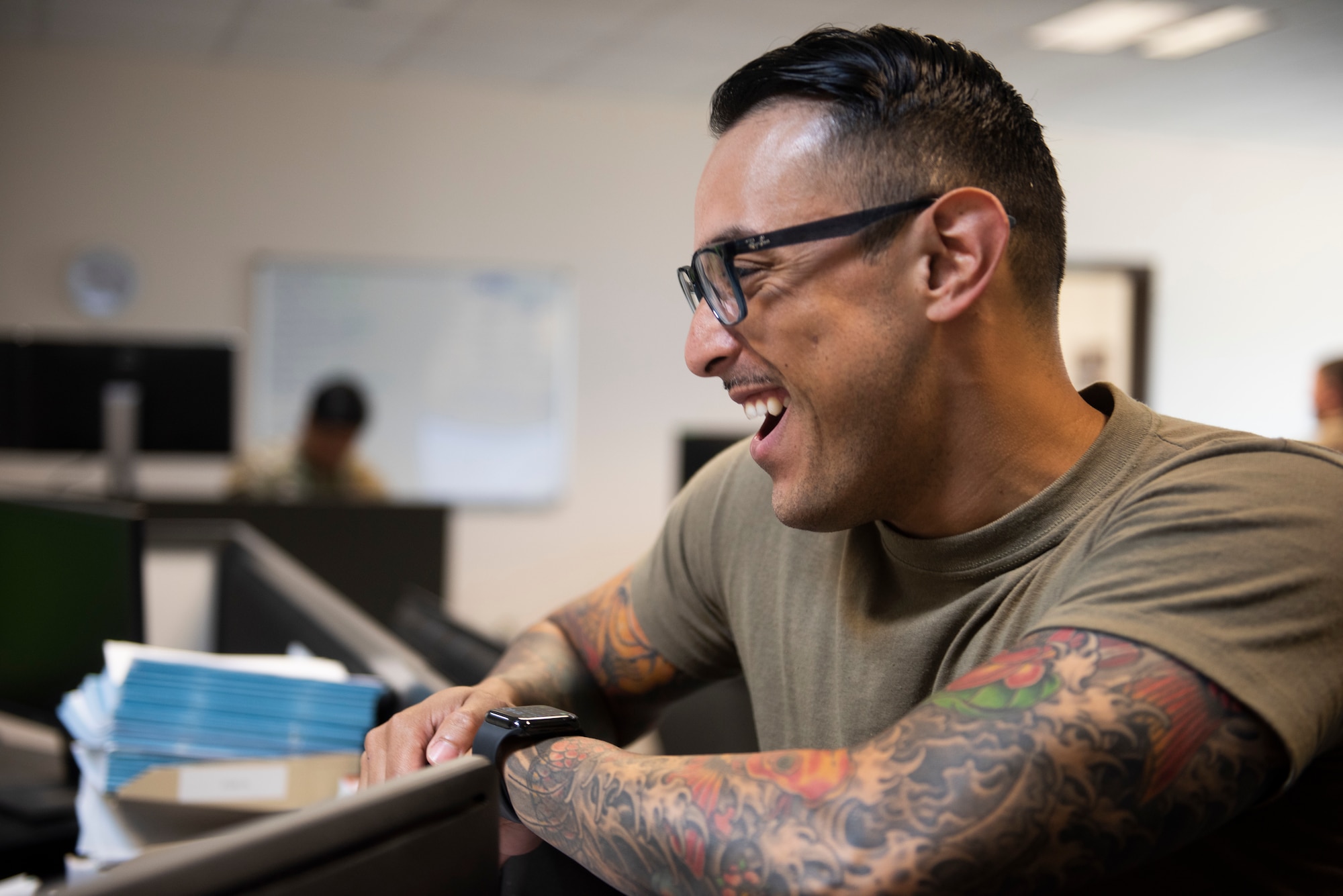Photo of an Airman laughing.